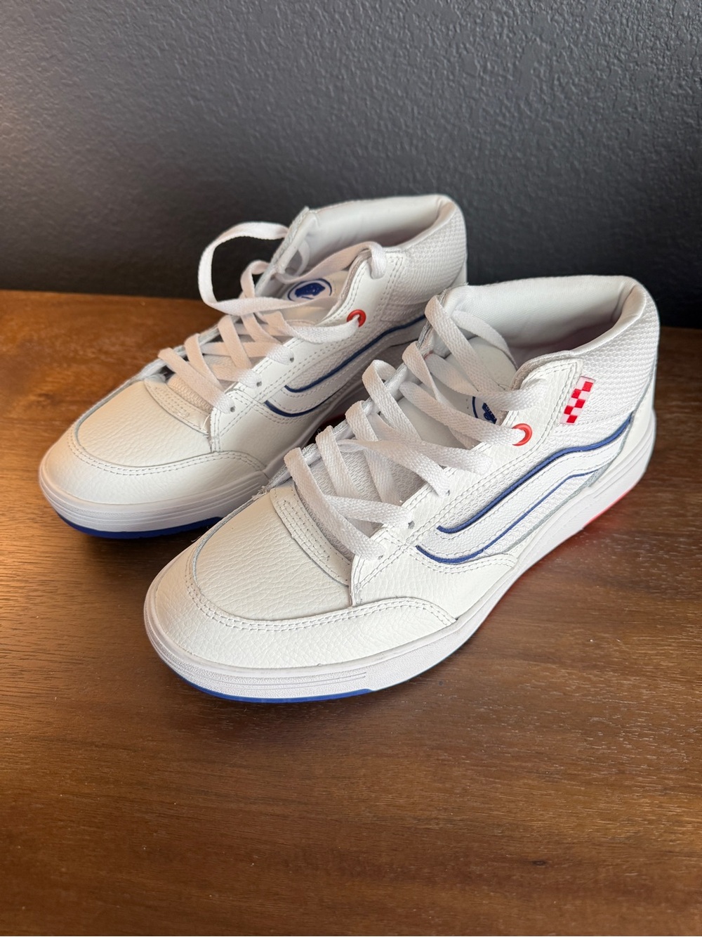 Men’s White Vans Sneakers with Blue and Red Accents